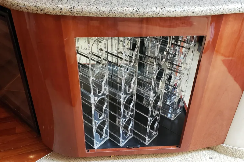 Slide: The Image of Built-in wine rack on a 2004 Sea Ray 550 Sundancer yacht with granite countertop. - 31