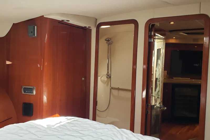 Slide: The Image of Luxurious interior of 2004 Sea Ray 550 Sundancer yacht with wood finishes and modern amenities. - 34