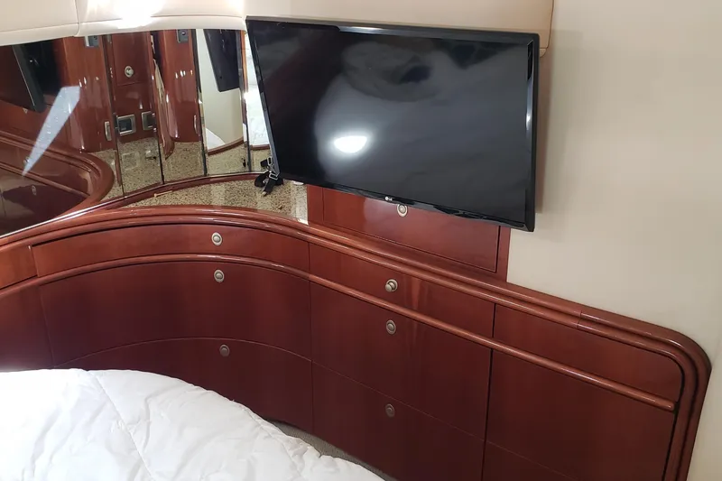 Slide: The Image of Luxurious 2004 Sea Ray 550 Sundancer cabin with TV and elegant wood cabinetry. - 35