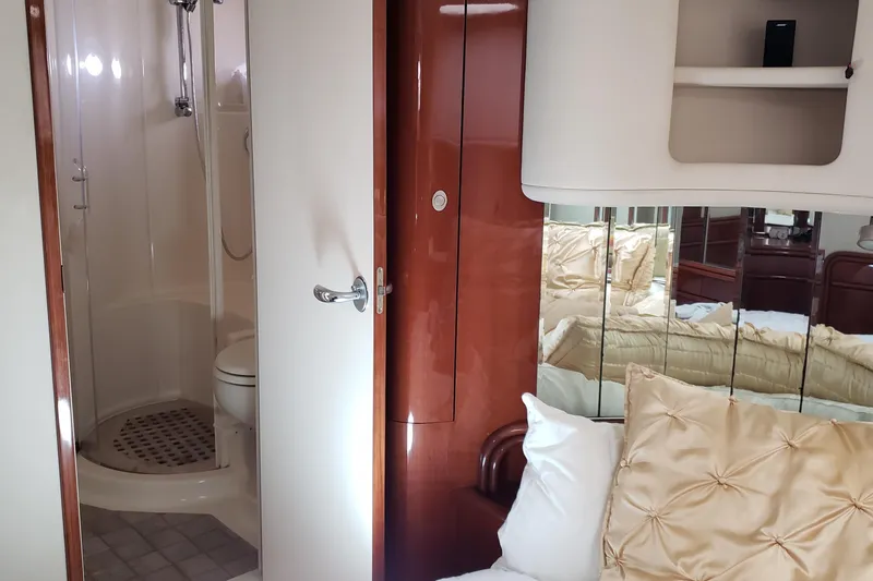 Slide: The Image of Luxurious 2004 Sea Ray 550 Sundancer cabin with elegant bathroom and plush bedding. - 37
