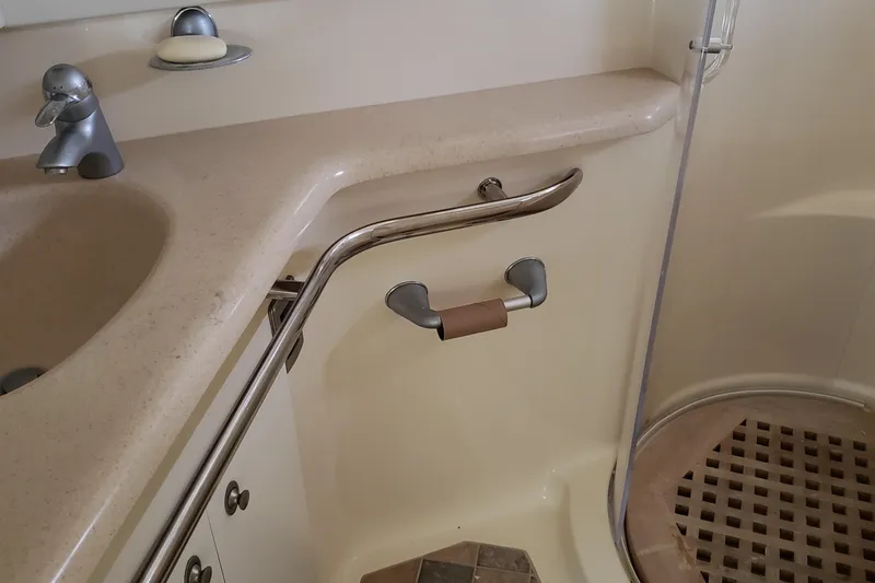Slide: The Image of Bathroom interior of 2004 Sea Ray 550 Sundancer yacht with sink and shower. - 39
