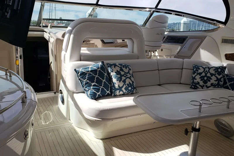 Slide: The Image of Luxurious interior of 2004 Sea Ray 550 Sundancer yacht with plush seating and decorative pillows. - 4