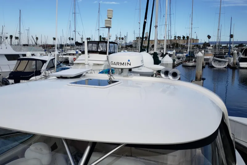 Slide: The Image of 2004 Sea Ray 550 Sundancer yacht with Garmin radar, docked in a marina. - 50