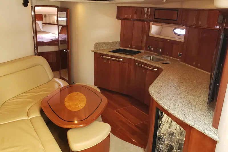 Slide: The Image of Luxurious interior of 2004 Sea Ray 550 Sundancer yacht with elegant wood finishes. - 55