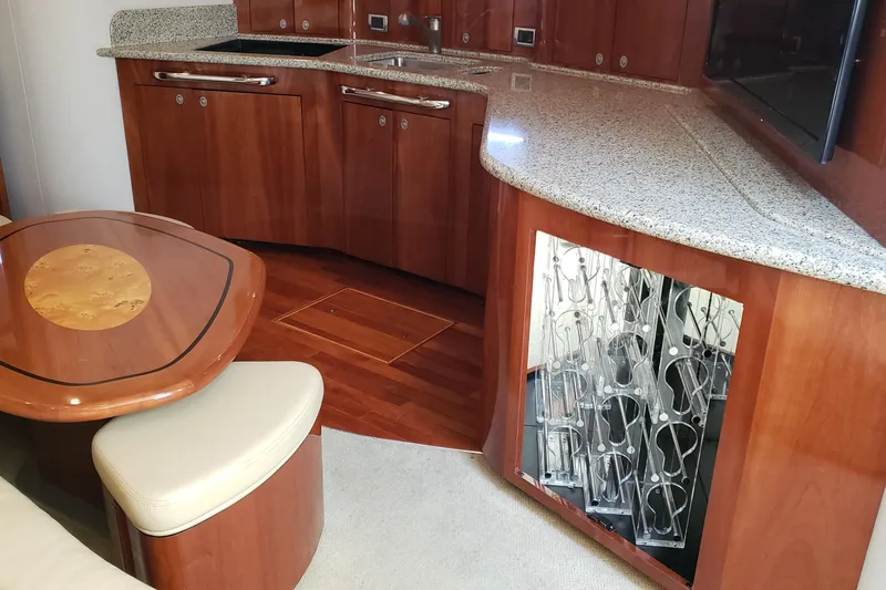 Slide: The Image of Luxurious 2004 Sea Ray 550 Sundancer yacht interior with elegant wood cabinetry and granite countertops. - 57