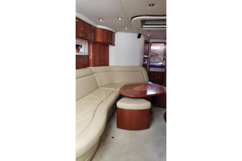 Slide: The Image of Luxurious interior of 2004 Sea Ray 550 Sundancer yacht with elegant seating and wooden finishes. - 59