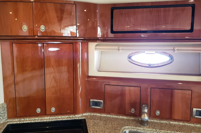 Slide: The Image of Luxurious wooden cabinetry in 2004 Sea Ray 550 Sundancer yacht interior. - 63