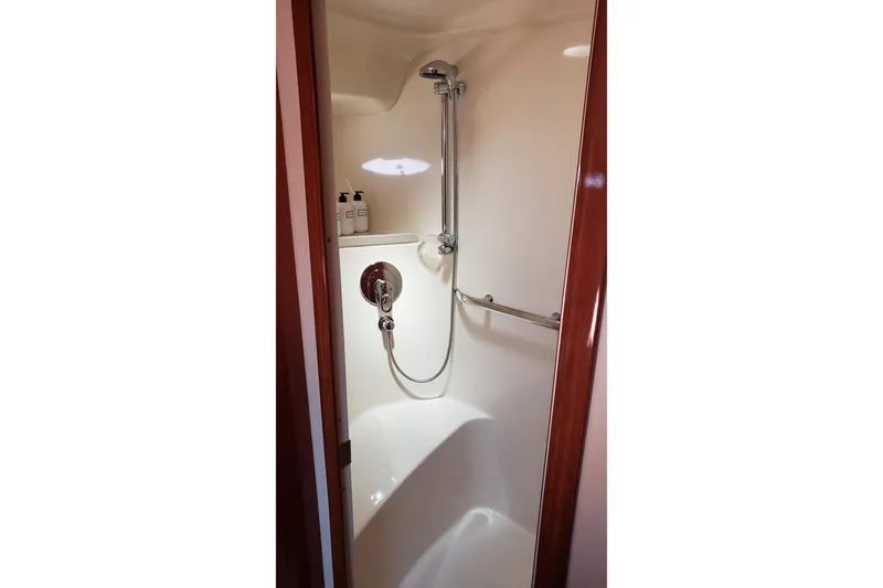 Slide: The Image of Shower area inside 2004 Sea Ray 550 Sundancer yacht, featuring sleek design and modern fixtures. - 73