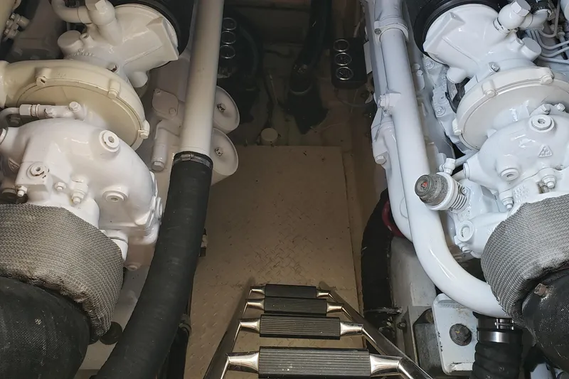Slide: The Image of Engine room of a 2004 Sea Ray 550 Sundancer yacht, showcasing dual engines. - 85