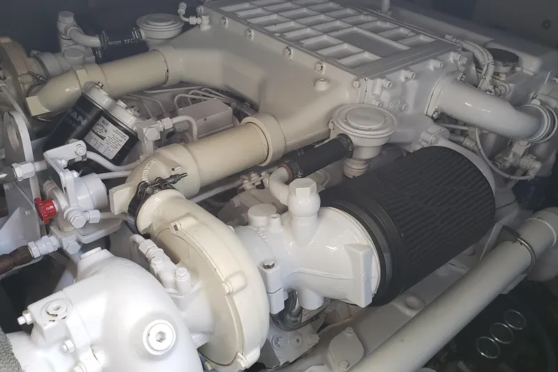 Slide: The Image of Engine compartment of a 2004 Sea Ray 550 Sundancer yacht, showcasing mechanical components. - 86