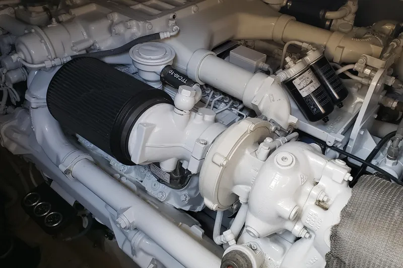 Slide: The Image of Engine compartment of a 2004 Sea Ray 550 Sundancer boat, showcasing mechanical components. - 87