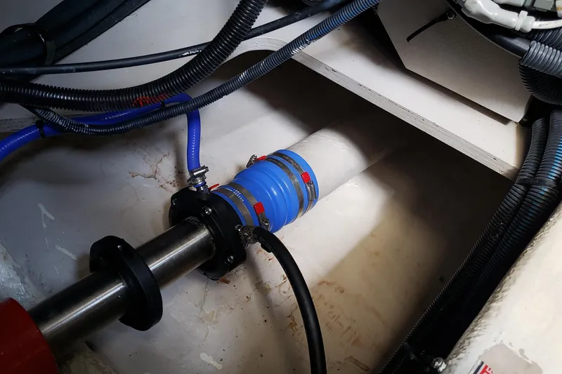 Slide: The Image of Engine compartment of a 2004 Sea Ray 550 Sundancer with visible mechanical components. - 89