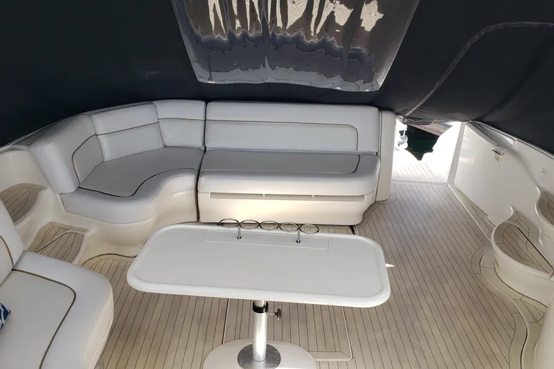 Slide: The Image of Luxurious interior of 2004 Sea Ray 550 Sundancer yacht with elegant seating and table. - 9