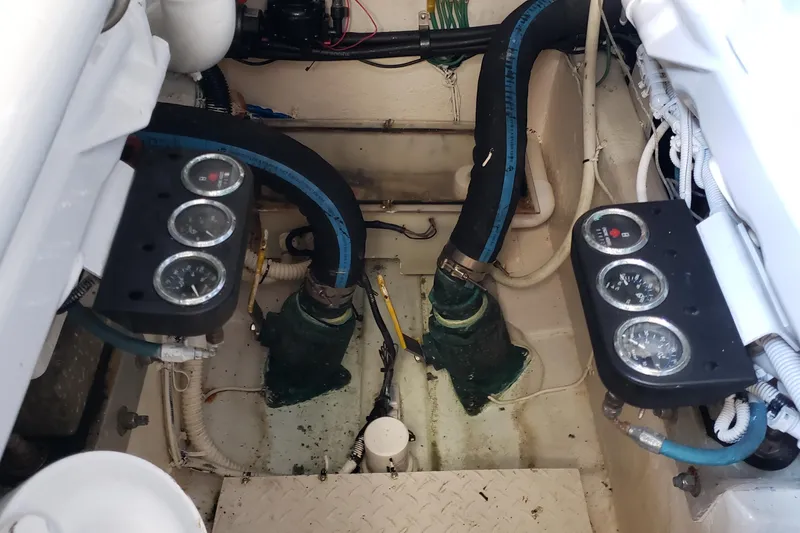 Slide: The Image of Engine room of 2004 Sea Ray 550 Sundancer with gauges and hoses visible. - 91