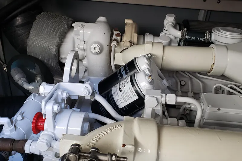 Slide: The Image of Engine components of a 2004 Sea Ray 550 Sundancer yacht, showcasing mechanical details. - 98