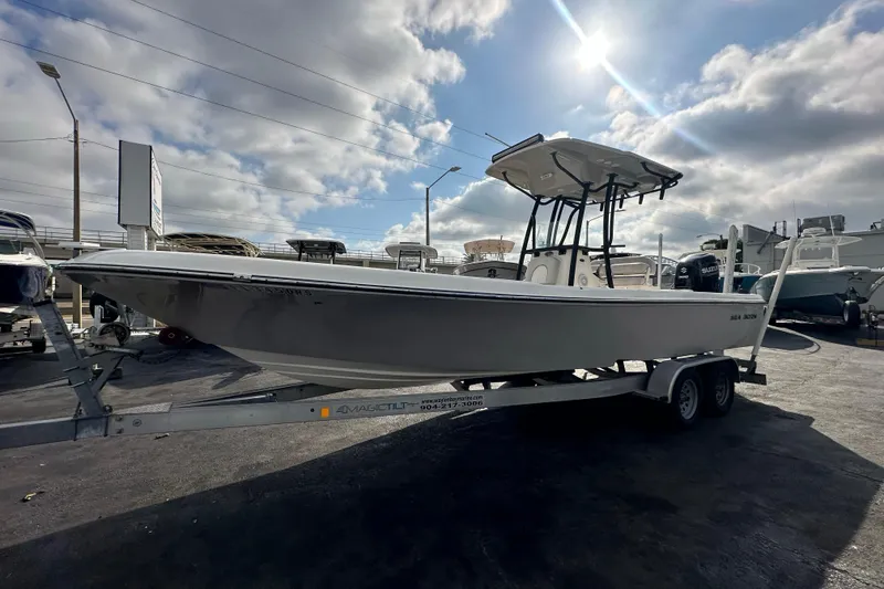 The Image of 2018 Sea Born FX25 Bay boat on trailer under cloudy sky. - 0