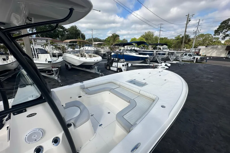 Slide: The Image of 2018 Sea Born FX25 Bay boat in a marina with other vessels. - 15