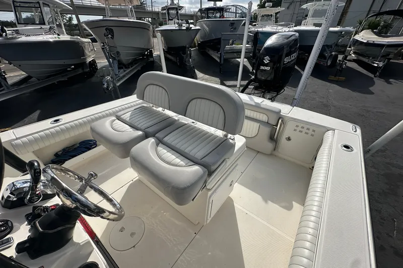 Slide: The Image of 2018 Sea Born FX25 Bay boat interior with seating and steering wheel. - 19