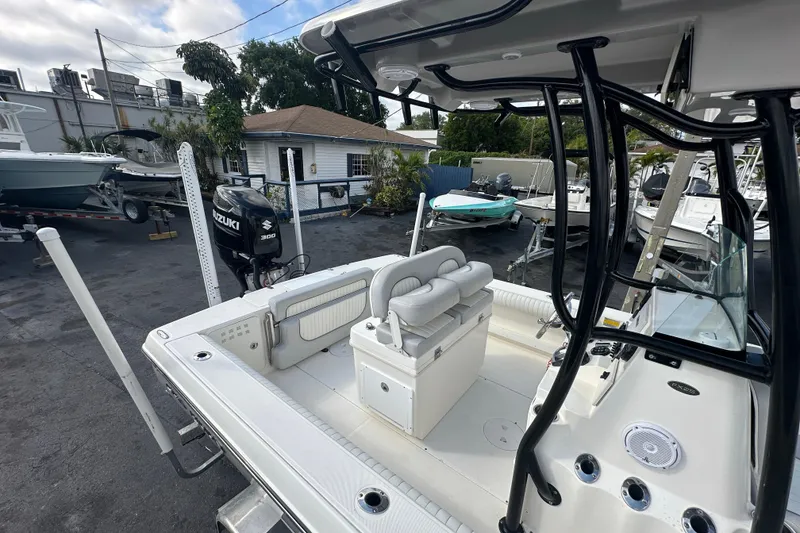 Slide: The Image of 2018 Sea Born FX25 Bay boat with Suzuki 300 engine in a marina setting. - 30