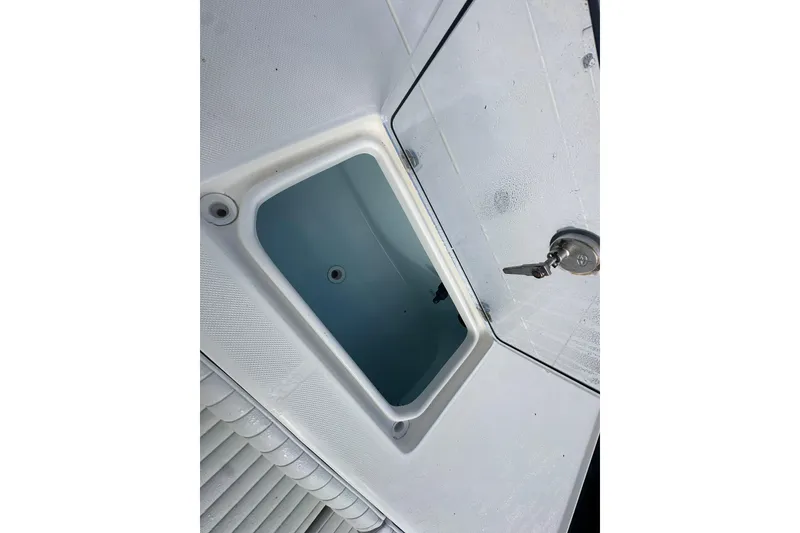 Slide: The Image of Open storage compartment on a 2018 Sea Born FX25 Bay boat. - 31