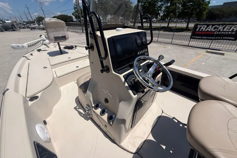 Slide: The Image of 2016 Blue Wave 2200 PureBay boat interior with steering console and seating. - 14