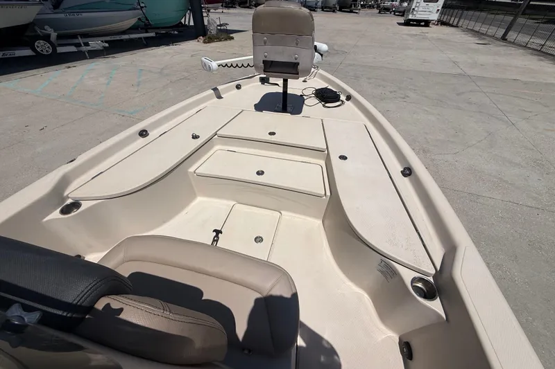 Slide: The Image of 2016 Blue Wave 2200 PureBay boat interior with seating and storage compartments. - 16