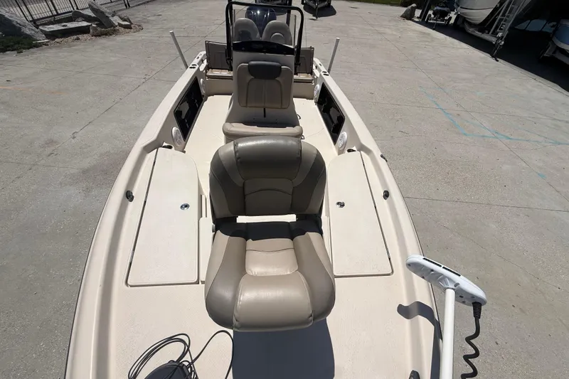 Slide: The Image of 2016 Blue Wave 2200 PureBay boat with beige seating and spacious deck layout. - 18