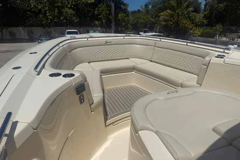 Slide: The Image of 2025 Scout 330 LXF boat interior with luxurious seating and elegant design. - 11