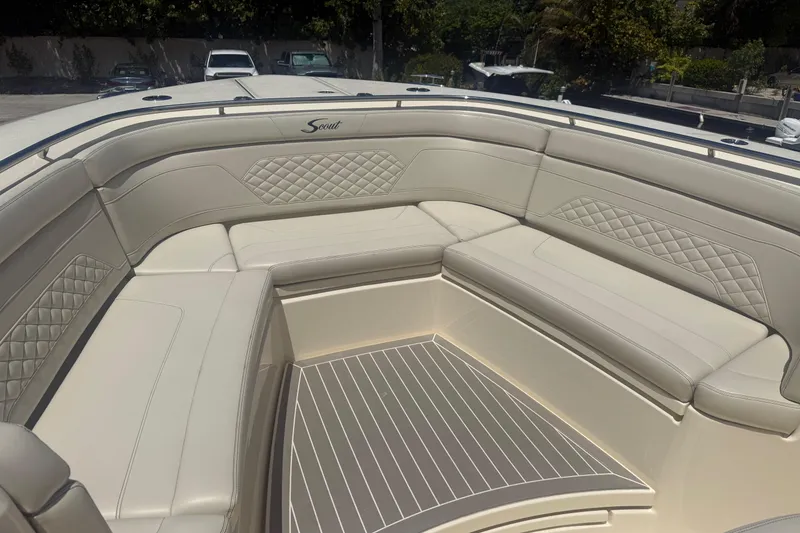 Slide: The Image of Luxurious seating area on 2025 Scout 330 LXF boat with quilted upholstery. - 12