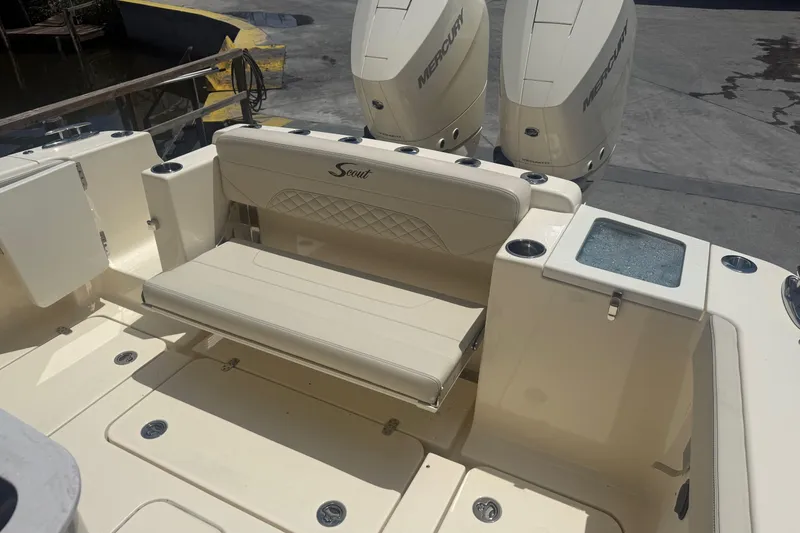 Slide: The Image of 2025 Scout 330 LXF boat interior with seating and Mercury engines. - 8