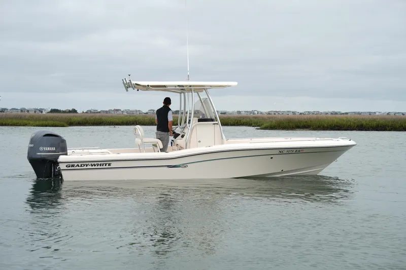 The Image of 2015 Grady-White 251 Coastal Explorer boat on calm water with Yamaha engine. - 1