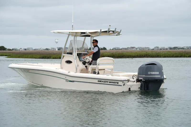 Slide: The Image of 2015 Grady-White 251 Coastal Explorer boat with Yamaha engine on calm water. - 10