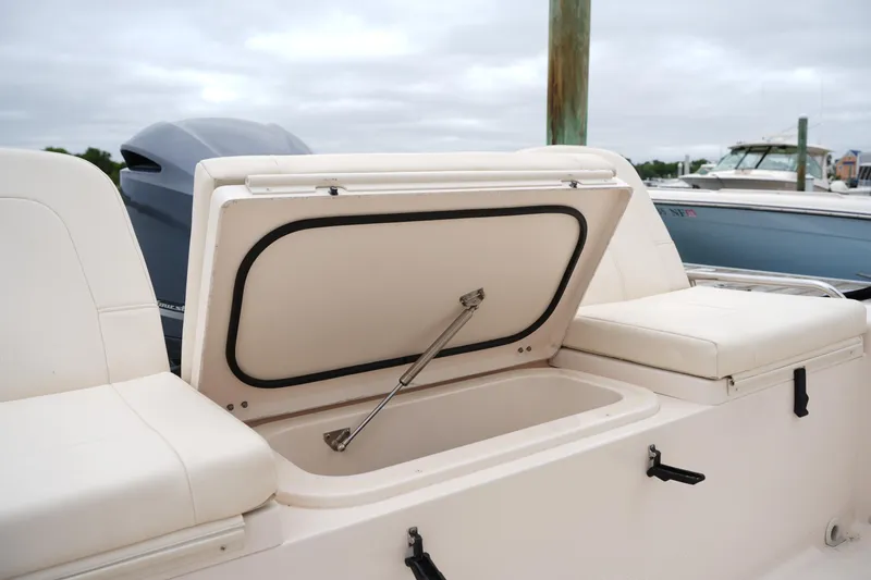 Slide: The Image of 2015 Grady-White 251 Coastal Explorer boat with open storage compartment. - 19