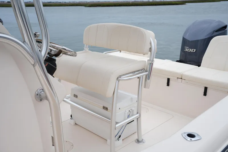 Slide: The Image of 2015 Grady-White 251 Coastal Explorer boat interior with seating and Yamaha 300 engine. - 21