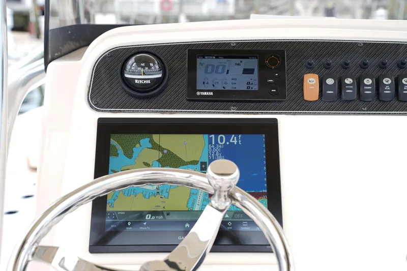 Slide: The Image of Dashboard of 2015 Grady-White 251 Coastal Explorer with navigation and control instruments. - 26