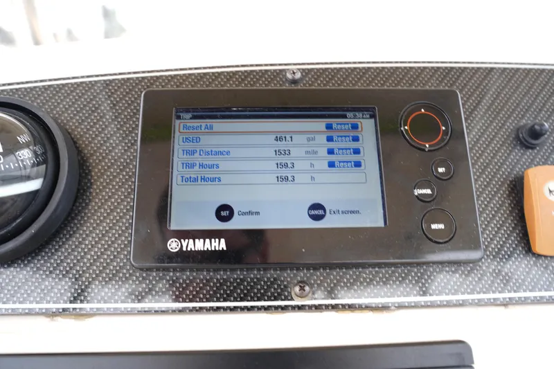 Slide: The Image of Yamaha display on 2015 Grady-White 251 Coastal Explorer showing trip data and settings. - 28