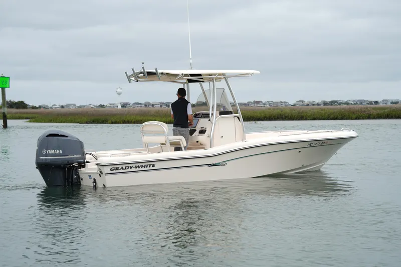 Slide: The Image of 2015 Grady-White 251 Coastal Explorer boat on water with Yamaha engine. - 3