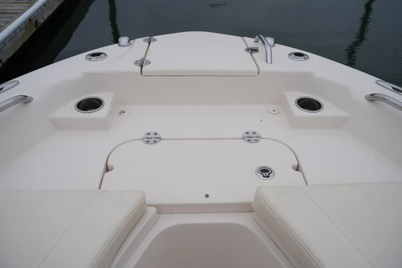 Slide: The Image of 2015 Grady-White 251 Coastal Explorer boat deck with seating and cup holders. - 38