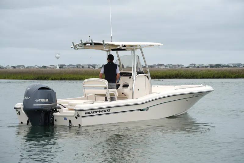 Slide: The Image of 2015 Grady-White 251 Coastal Explorer boat on calm water with Yamaha engine. - 4