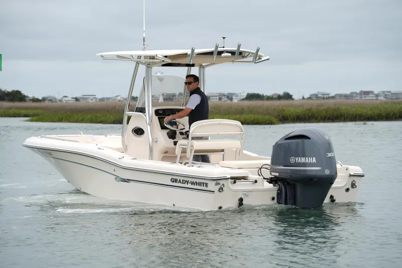 Slide: The Image of 2015 Grady-White 251 Coastal Explorer boat with Yamaha engine on calm water. - 9