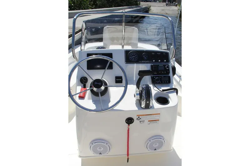 Slide: The Image of Manufacturer Provided Image: 2021 Boston Whaler 150 Montauk boat console with steering wheel and controls. - 5