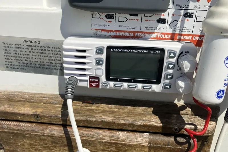 Slide: The Image of VHF radio on 1983 Boston Whaler 17 Montauk, featuring Standard Horizon Eclipse model. - 13
