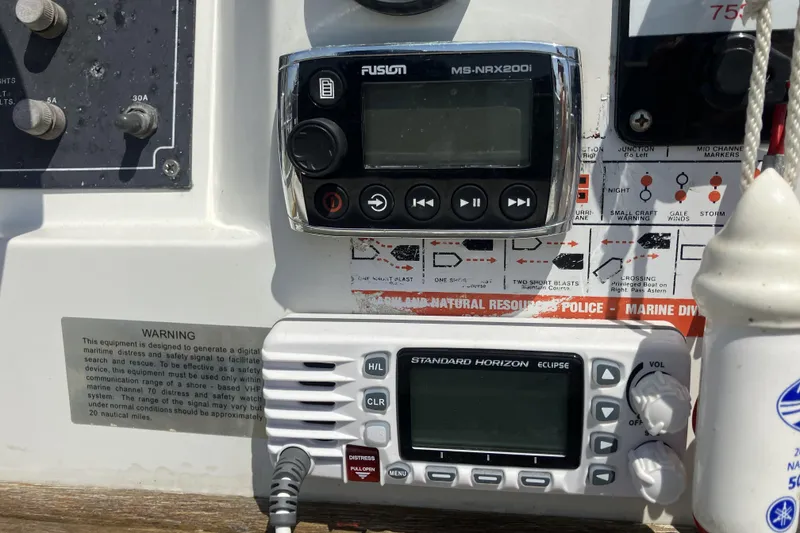 Slide: The Image of Control panel of a 1983 Boston Whaler 17 Montauk with radio and navigation equipment. - 14