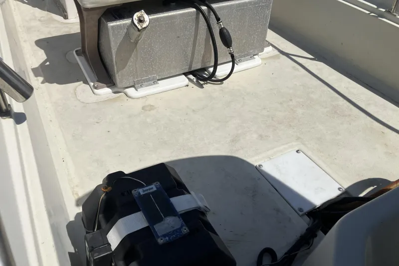 Slide: The Image of Interior of a 1983 Boston Whaler 17 Montauk boat showing equipment and storage. - 17