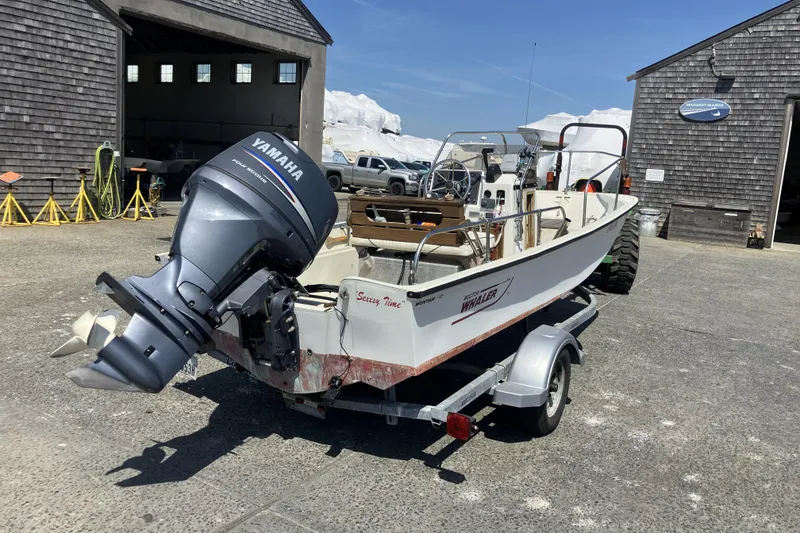 Slide: The Image of 1983 Boston Whaler 17 Montauk boat with Yamaha outboard motor on trailer. - 3
