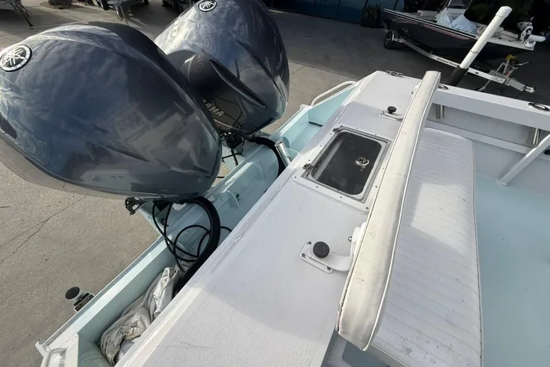 Slide: The Image of Twin Yamaha outboard engines on a 2012 Custom 32 CC boat, docked and ready. - 12