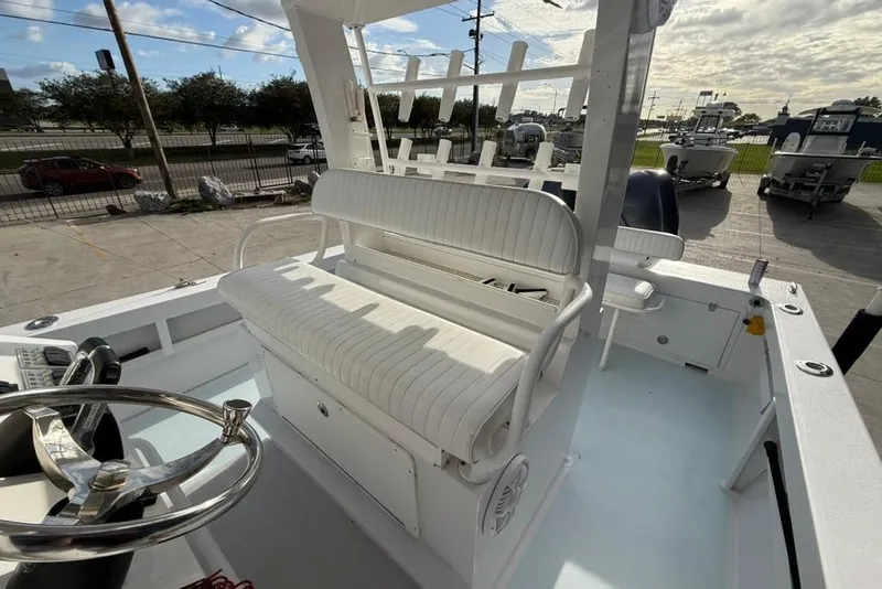 Slide: The Image of Custom 32 CC boat interior, 2012 model, featuring white seating and steering wheel. - 14