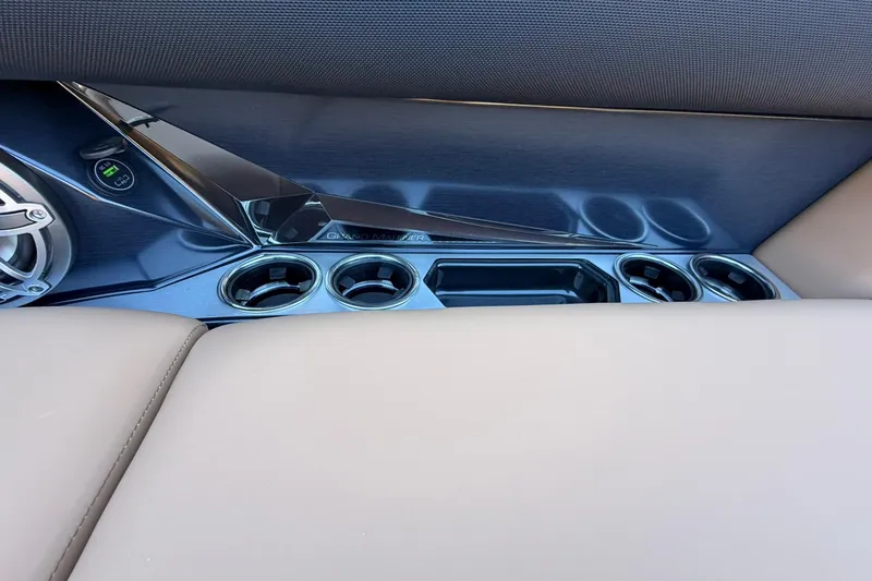 Slide: The Image of Interior of 2026 Harris Grand Mariner 250 SL with cup holders and sleek design. - 12