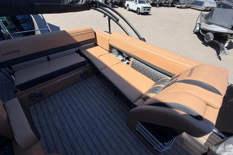 Slide: The Image of 2026 Harris Grand Mariner 250 SL boat interior with luxurious tan seating and modern design. - 16