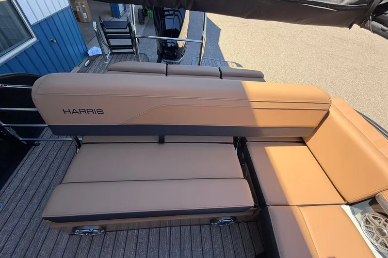 Slide: The Image of 2026 Harris Grand Mariner 250 SL boat with tan seating and sleek design. - 18
